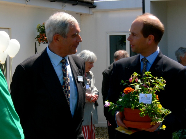 Robin presenting Prince Edward with plants